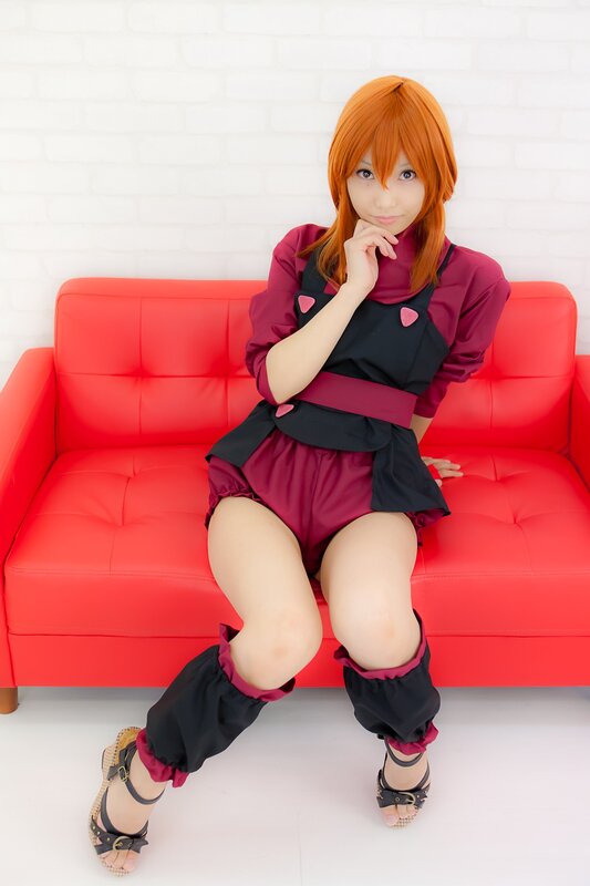 cosplayer on red couch