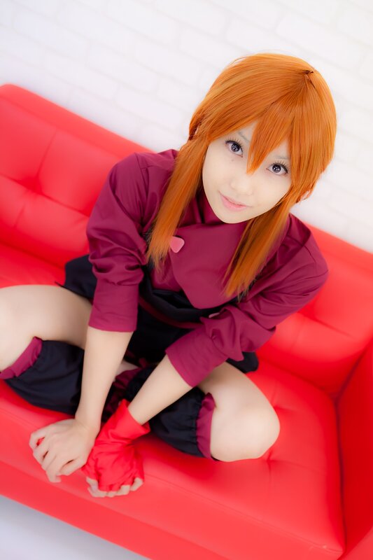 cosplayer on red couch