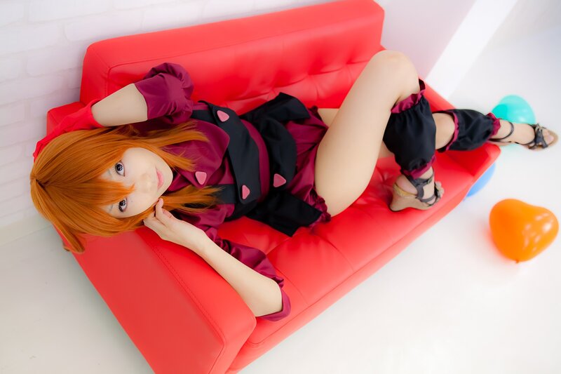 cosplayer on red couch