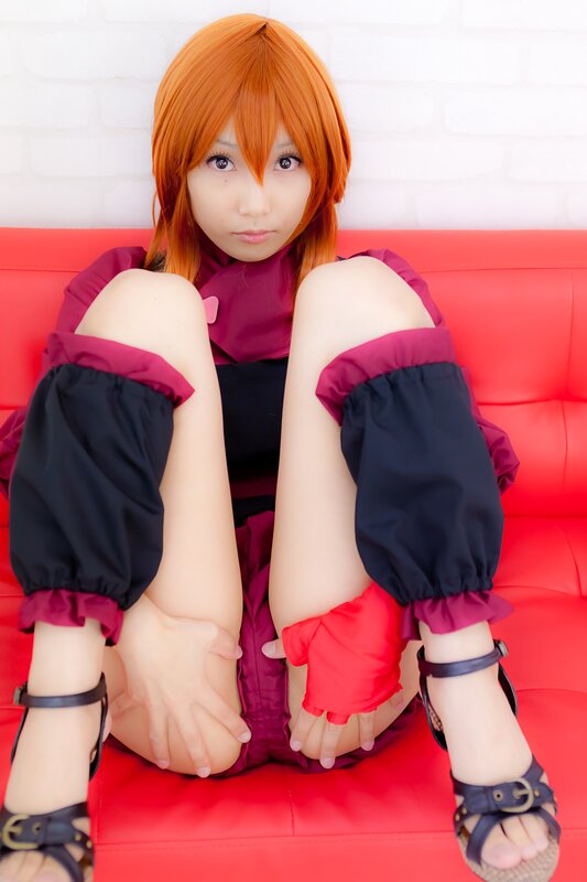 cosplayer on red couch