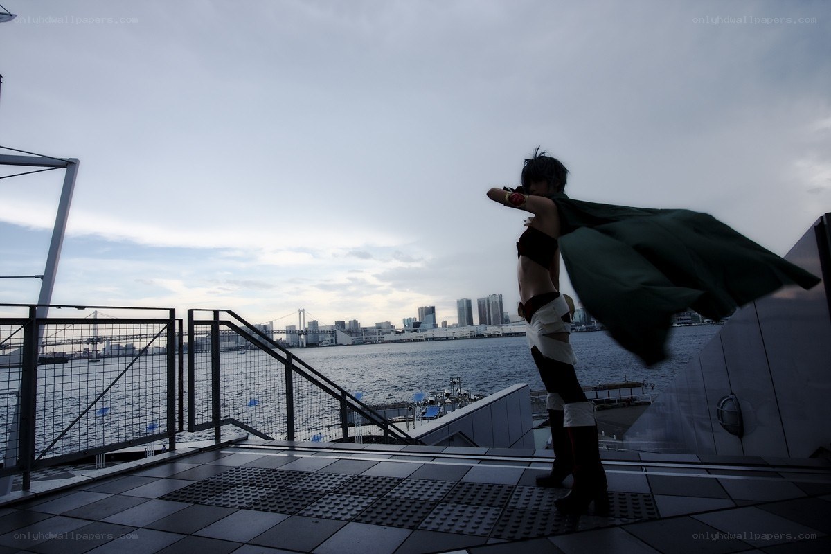 cosplayer on rooftop overlooking city