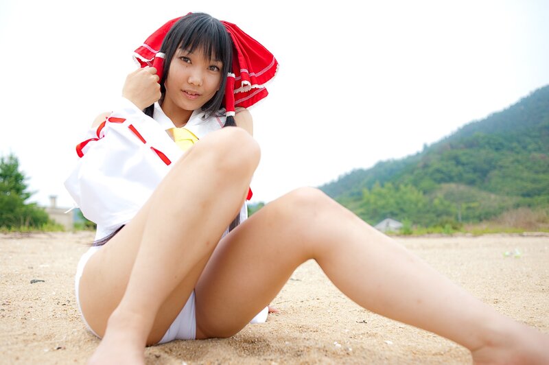 cosplayer on sandy beach