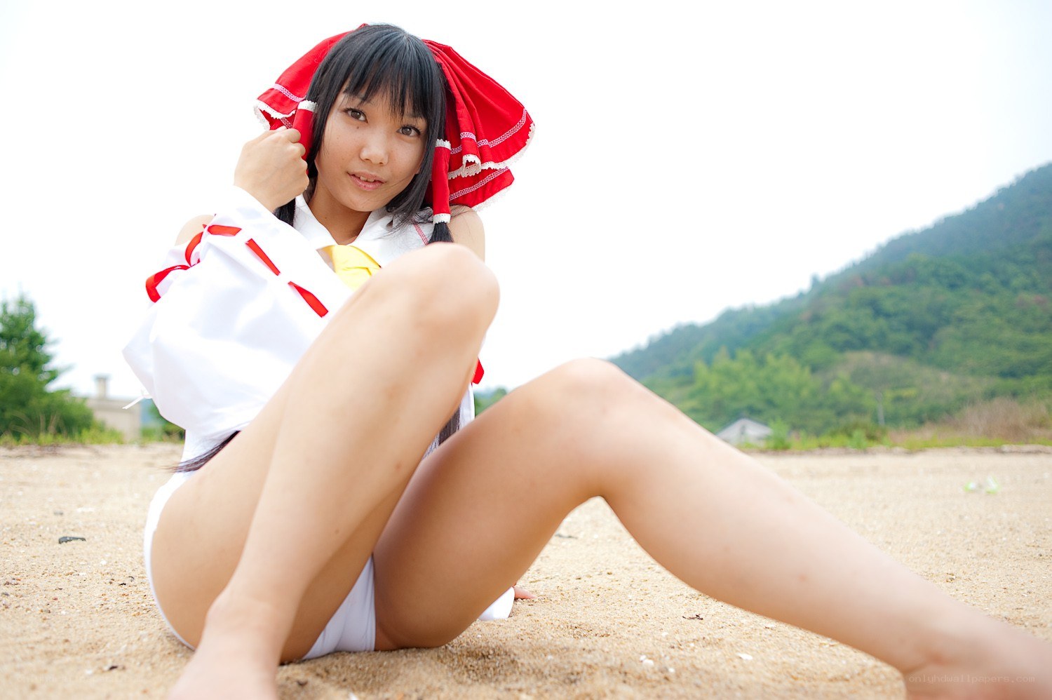 cosplayer on sandy beach