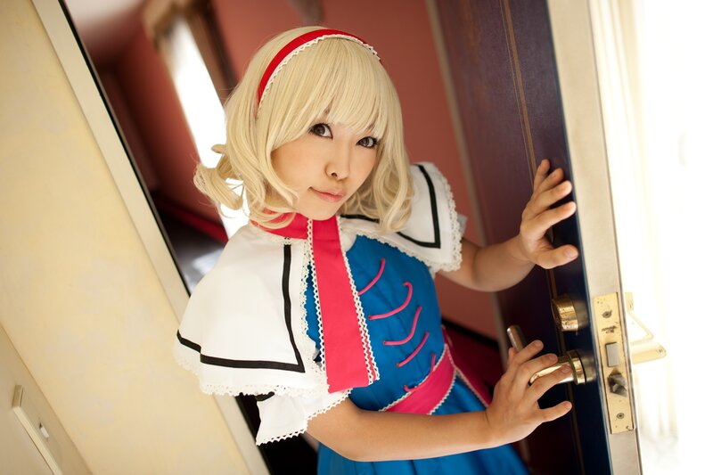cosplayer opening a door