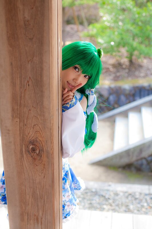 cosplayer peeking from behind a post