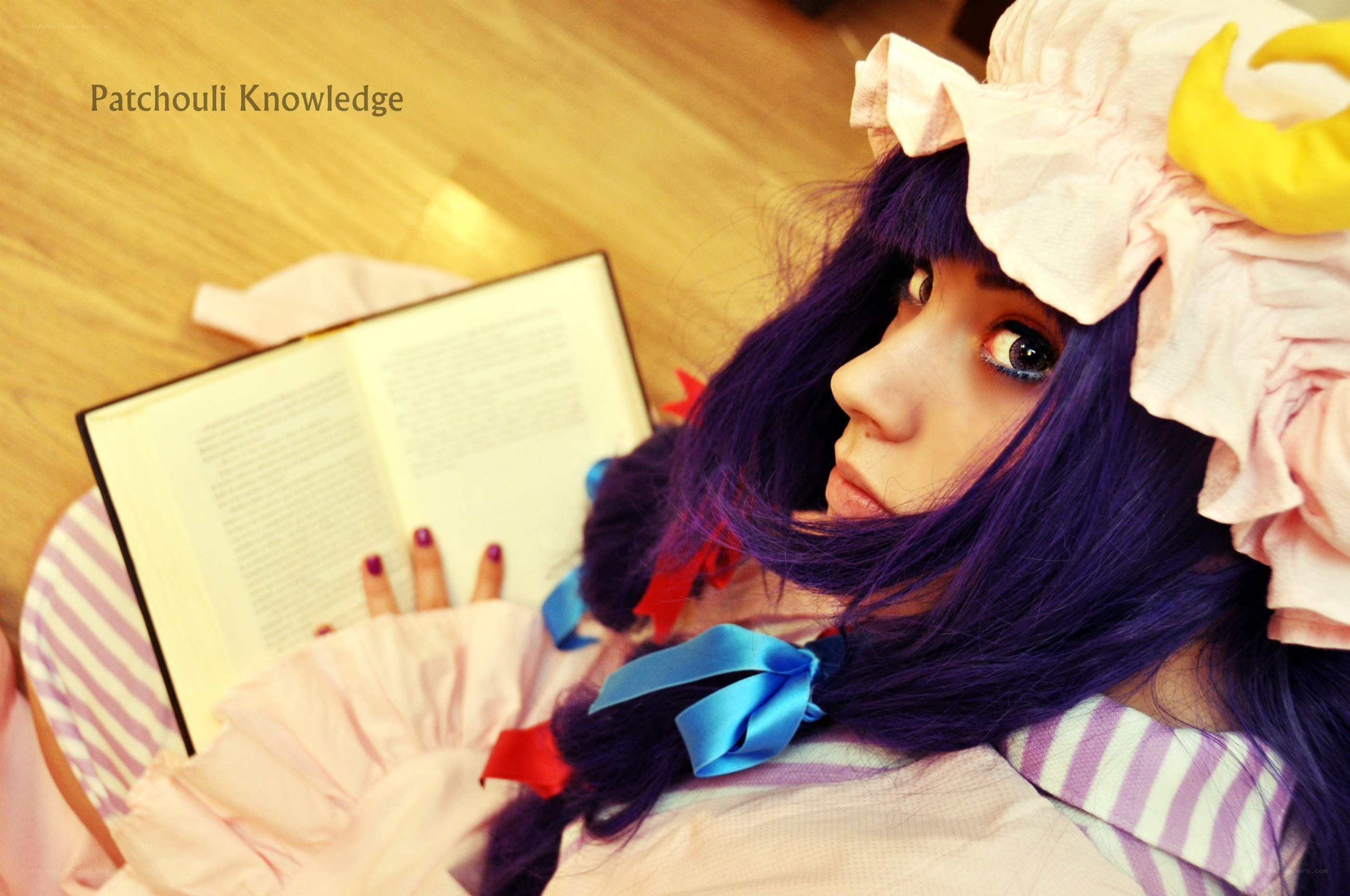cosplayer reading book