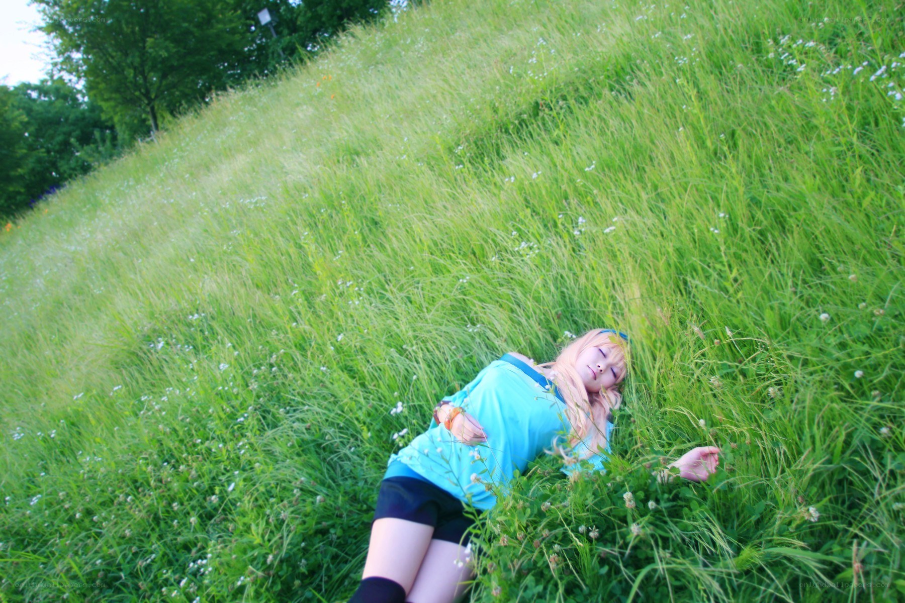Cosplayer resting in a field