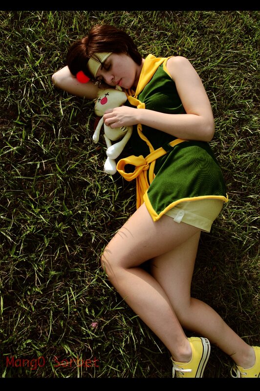 Cosplayer resting on grass