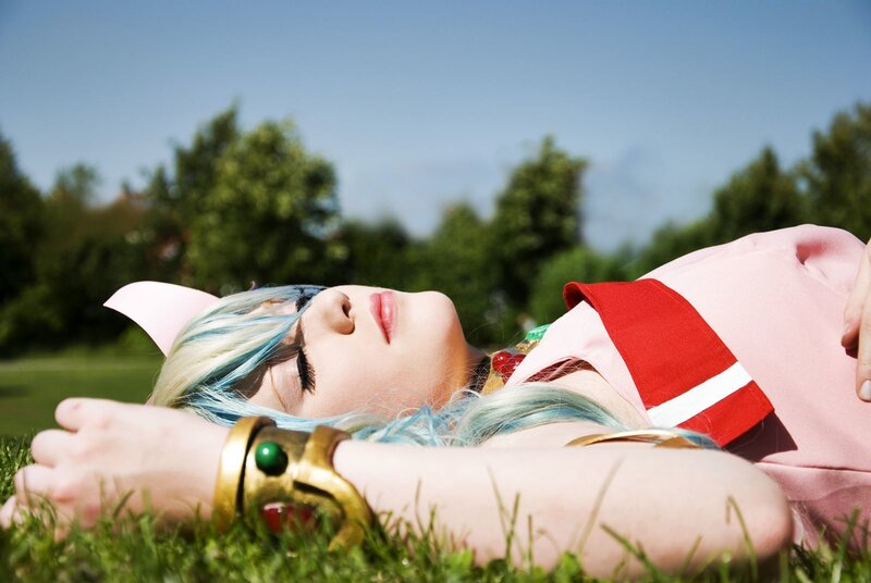 cosplayer resting on grass