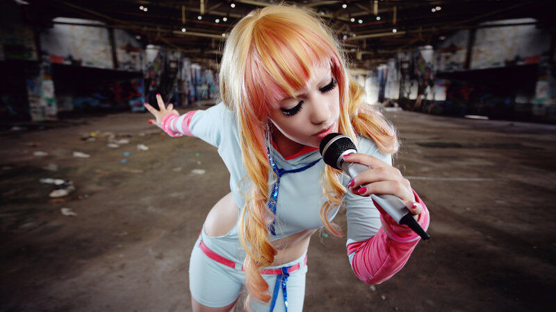 cosplayer singing in warehouse