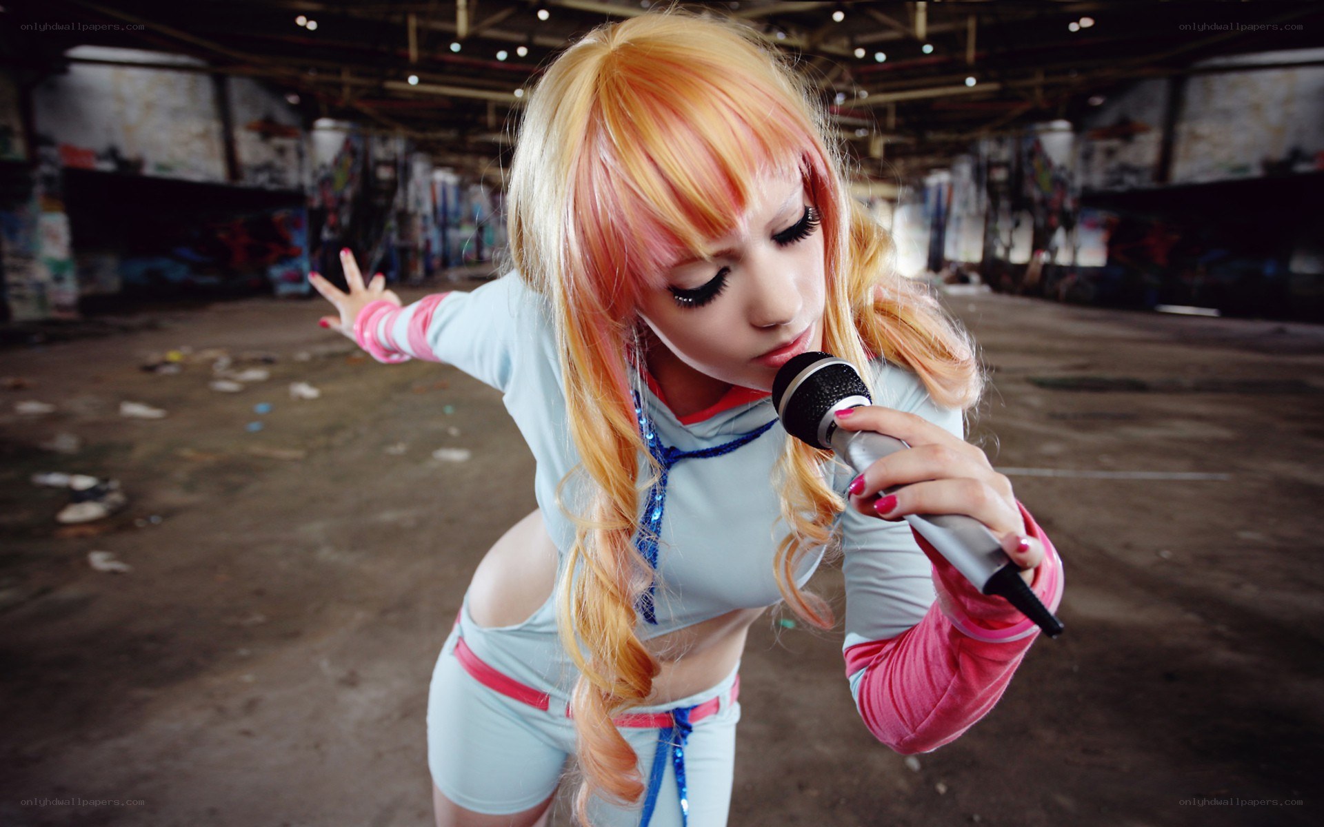 cosplayer singing into microphone