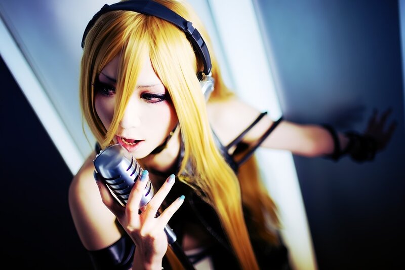 cosplayer singing into microphone