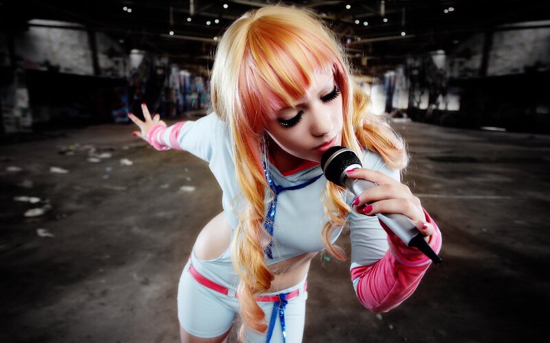 cosplayer singing into microphone
