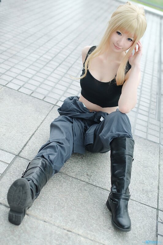 cosplayer sitting on pavement