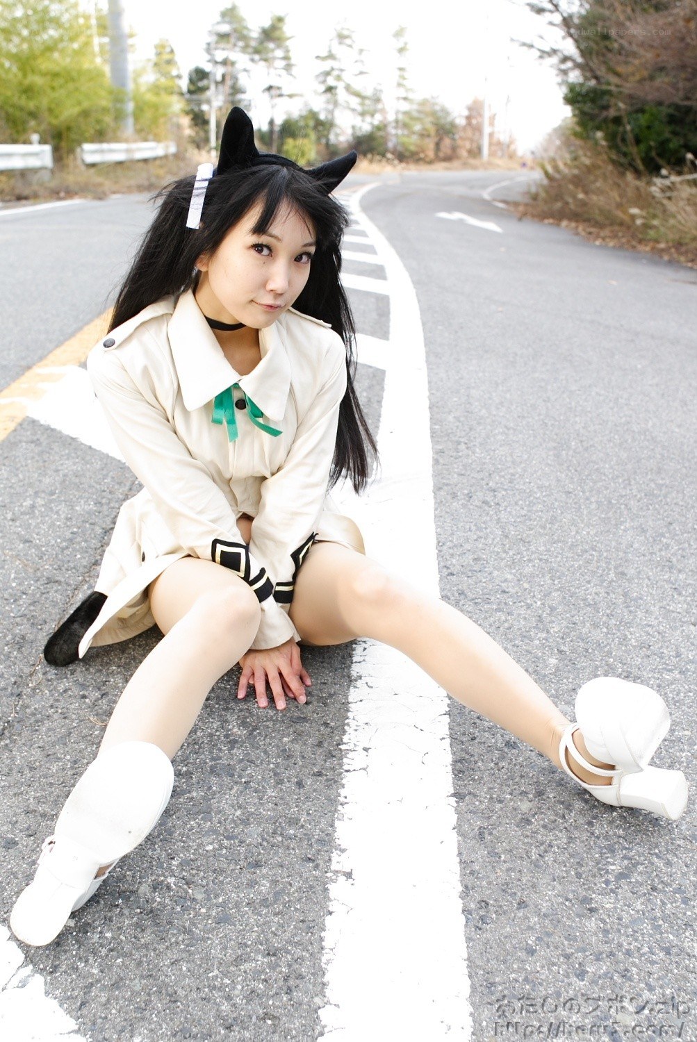 cosplayer sitting on road