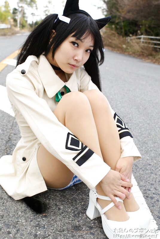 cosplayer sitting on road