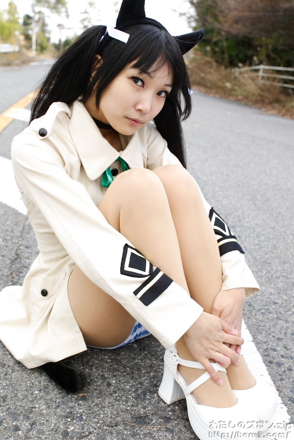 cosplayer sitting on road