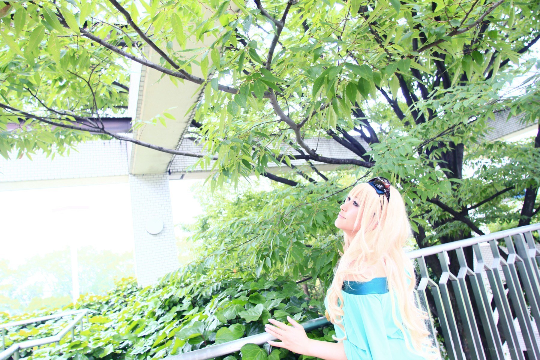 cosplayer under green trees