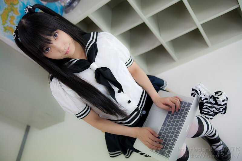 cosplayer using laptop