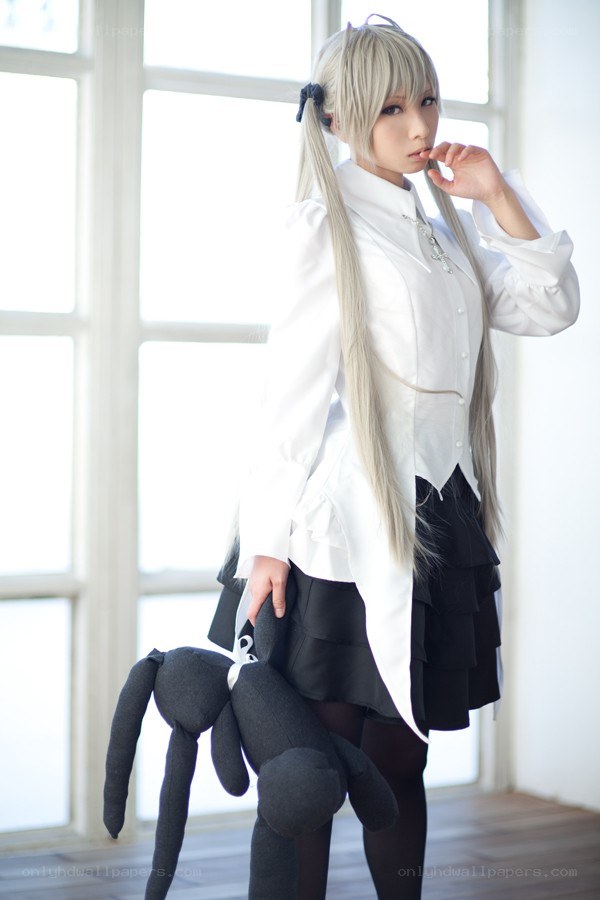 cosplayer with black plush toy