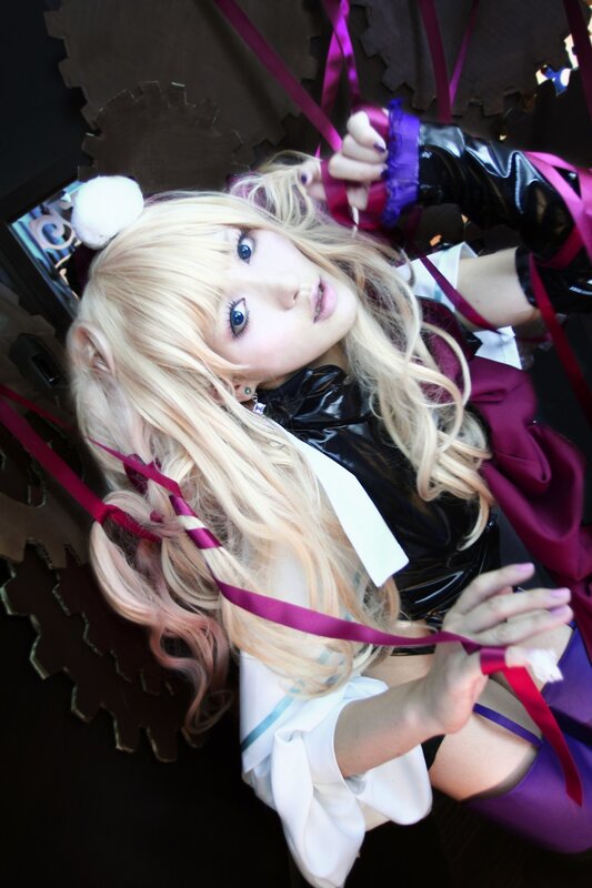 cosplayer with blonde hair and ribbons