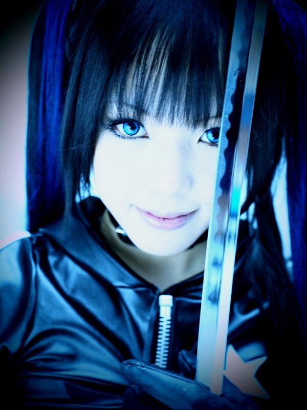 cosplayer with blue eyes and sword