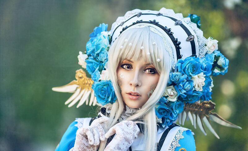 Cosplayer with Blue Flowers — Dramatic