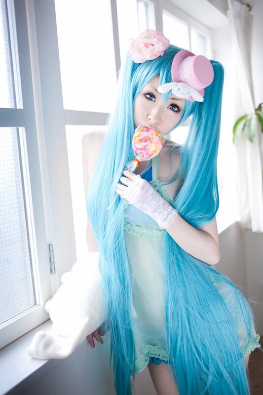 cosplayer with blue hair and lollipop