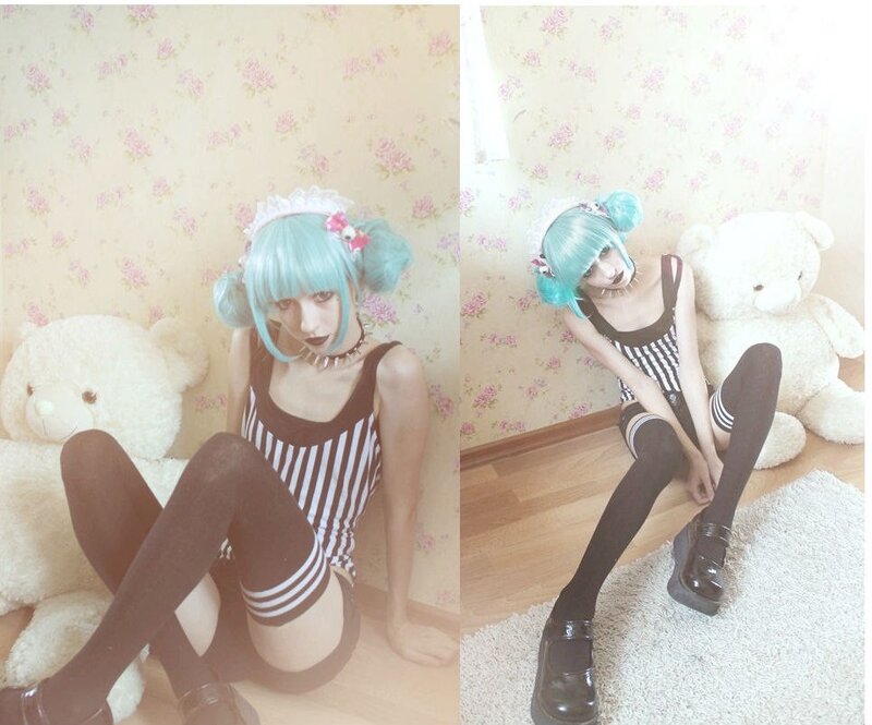 cosplayer with blue hair and teddy bear