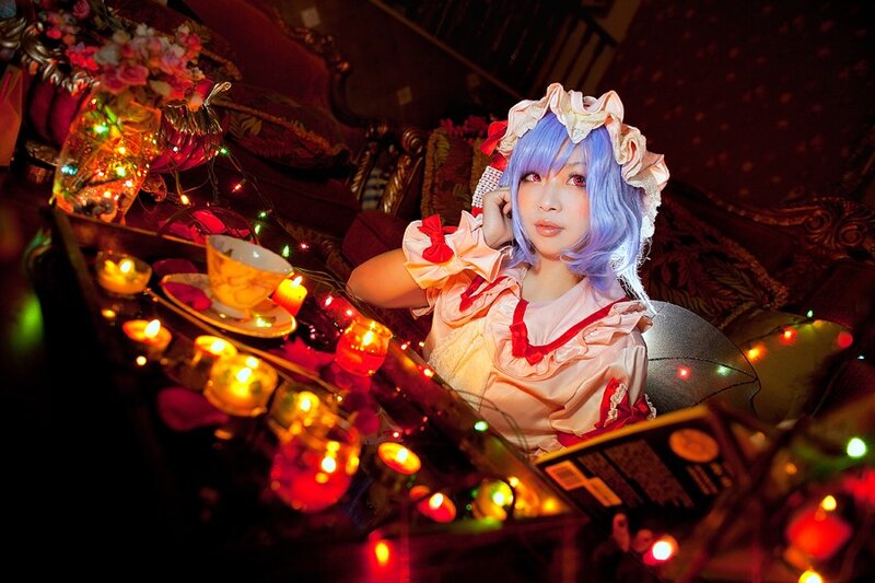 cosplayer with blue hair at tea party
