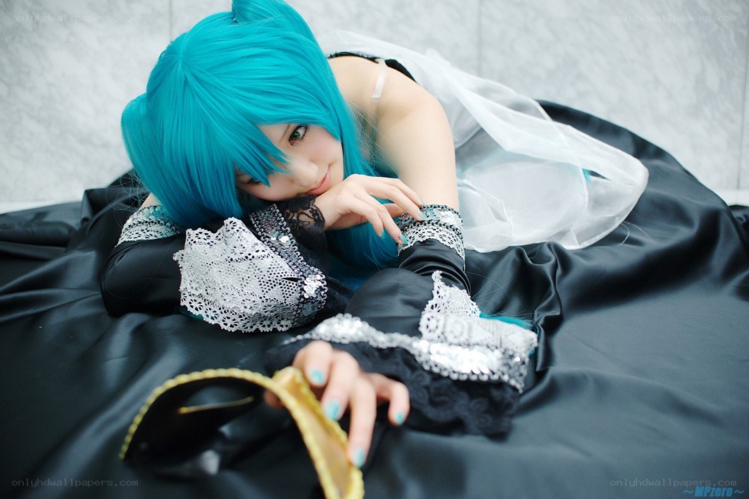 cosplayer with blue hair lying down