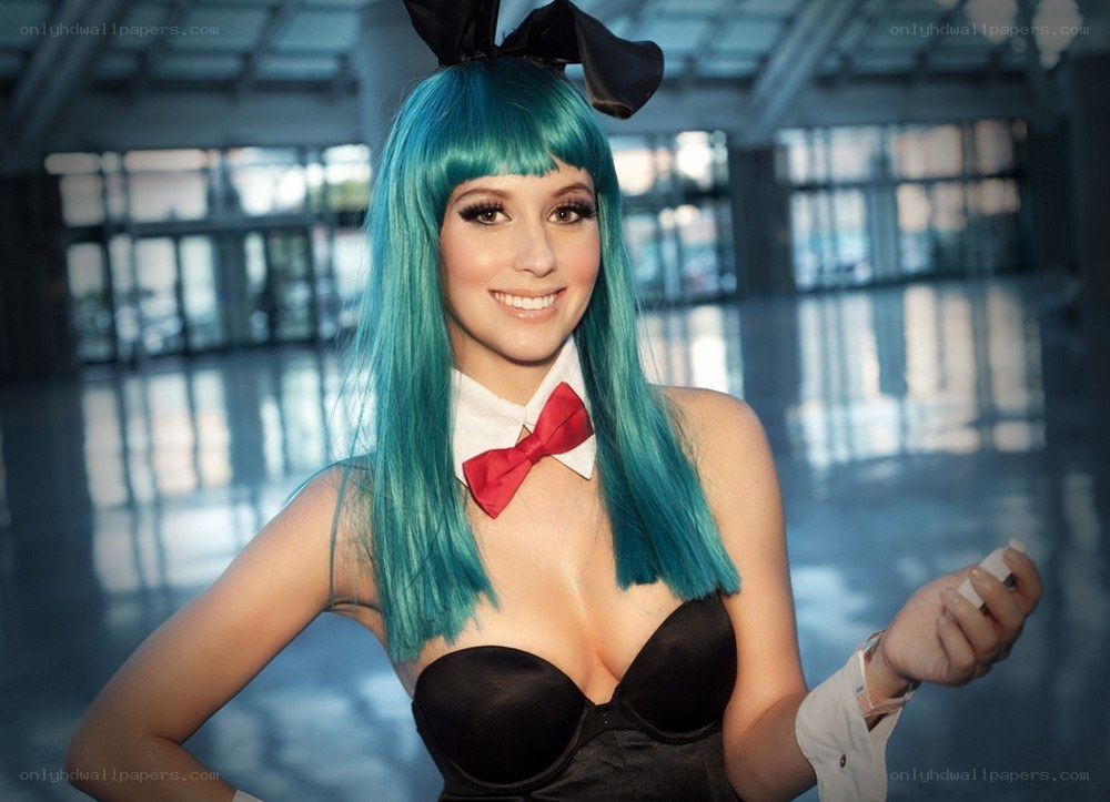cosplayer with blue wig and bow