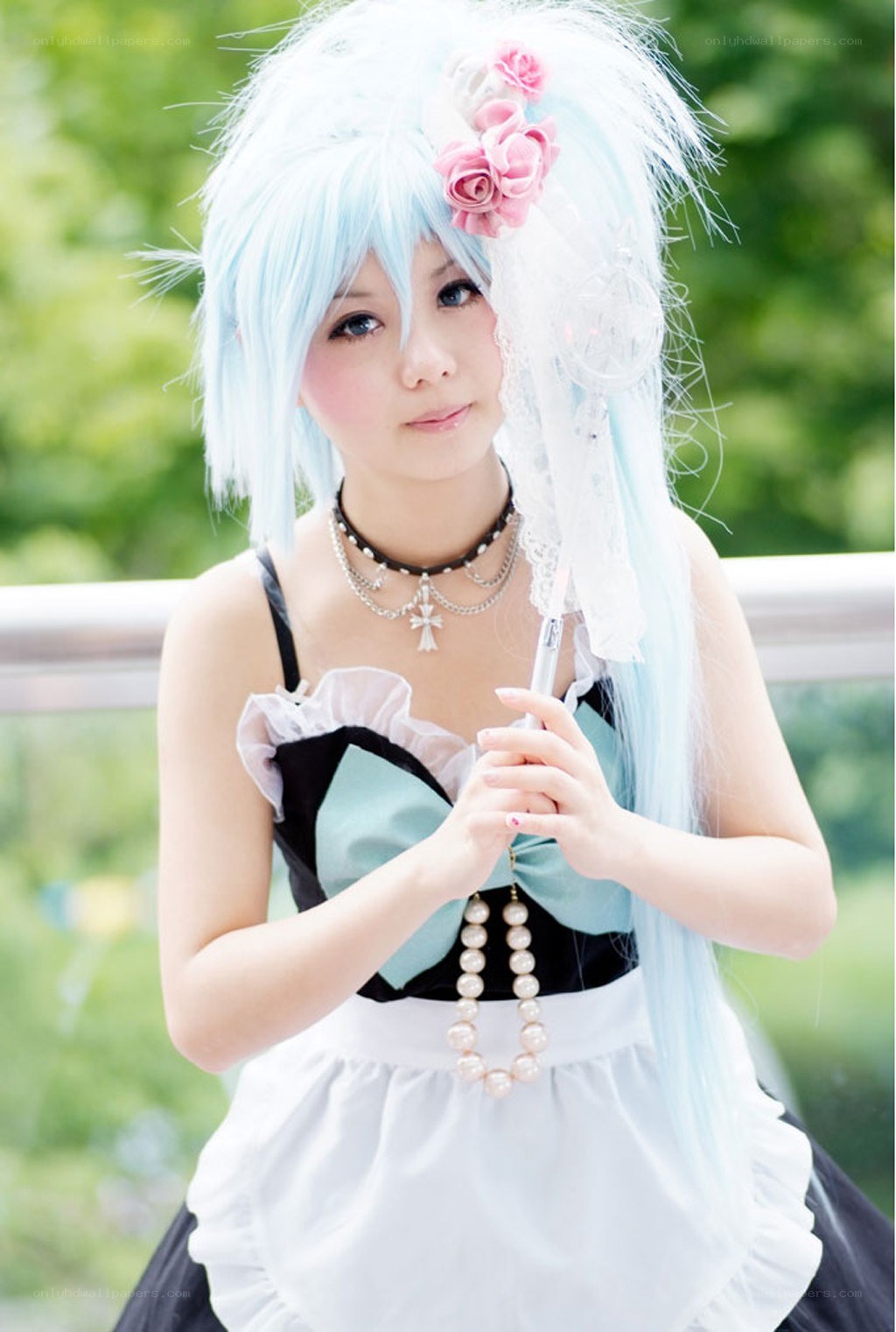 cosplayer with blue wig and flowers