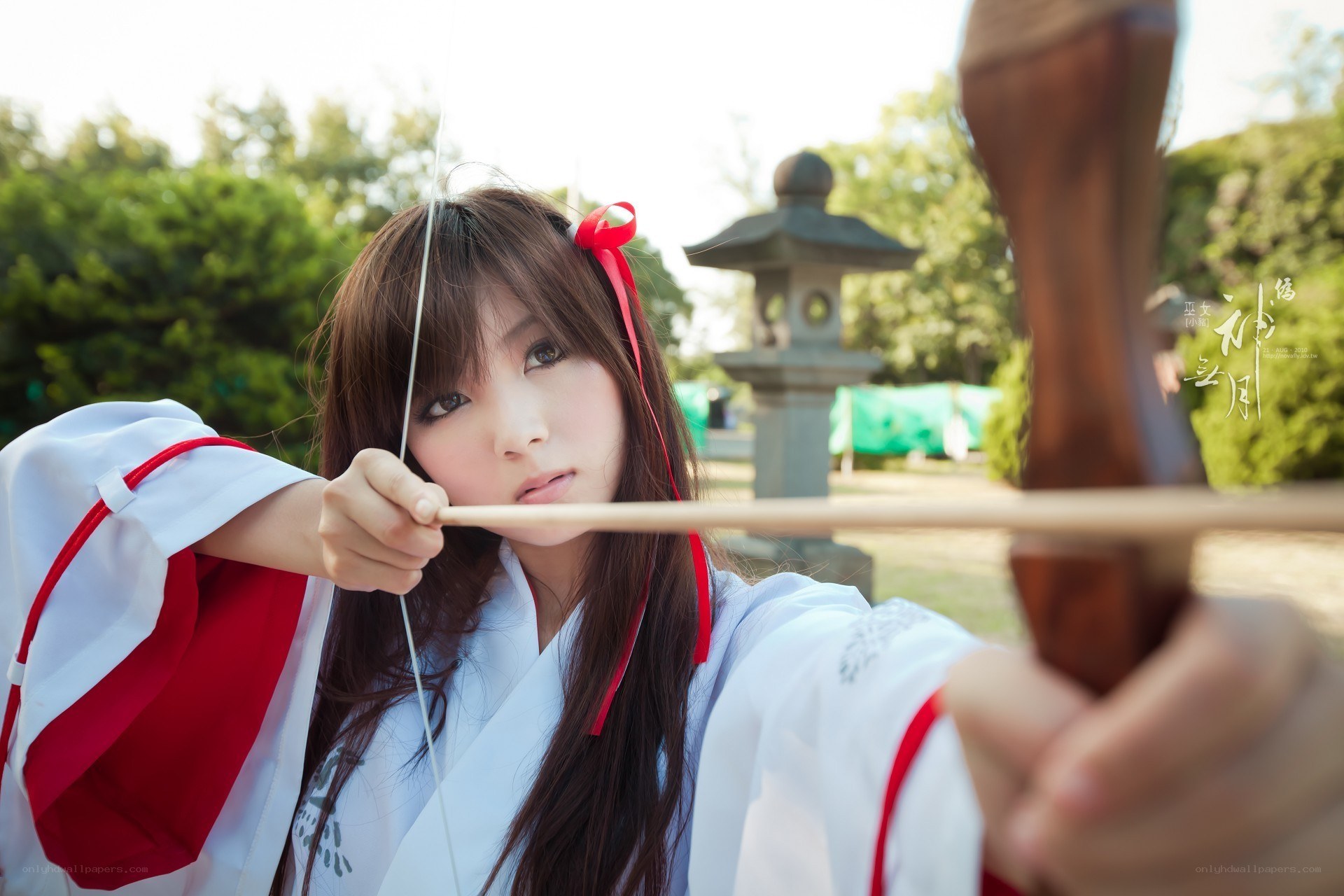 cosplayer with bow and arrow