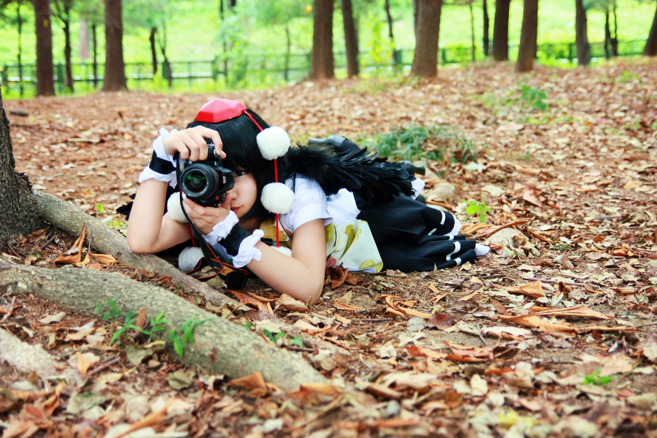 cosplayer with camera in forest