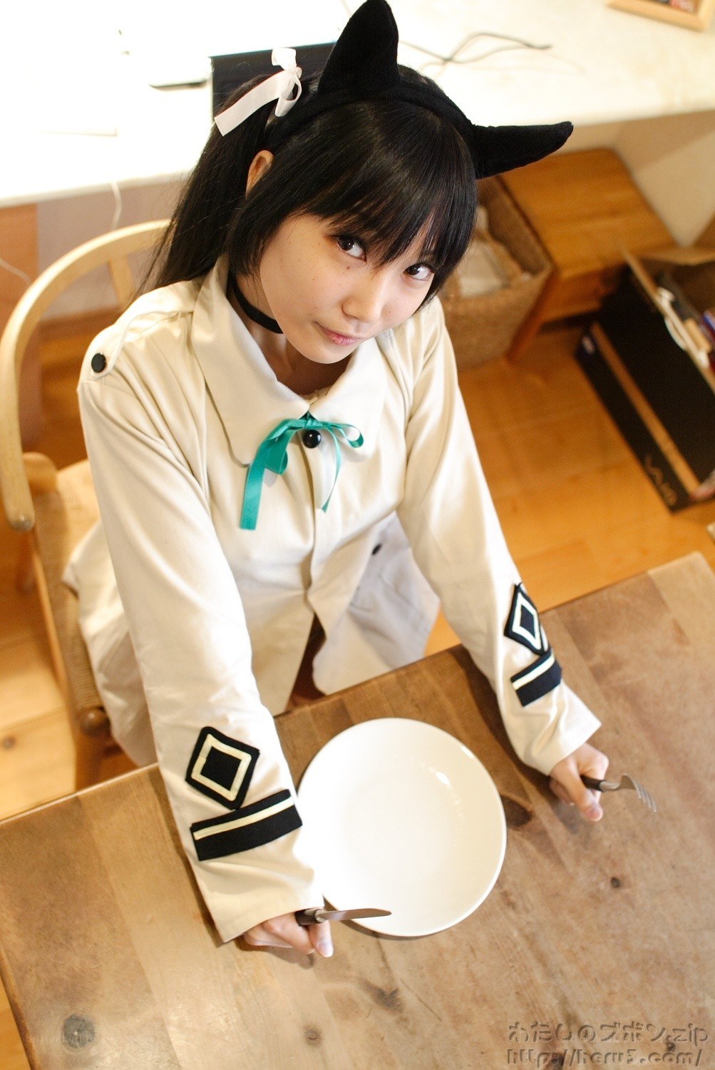 cosplayer with cat ears at table