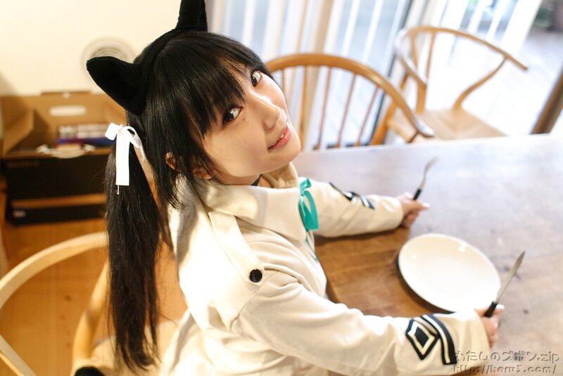 cosplayer with cat ears at table