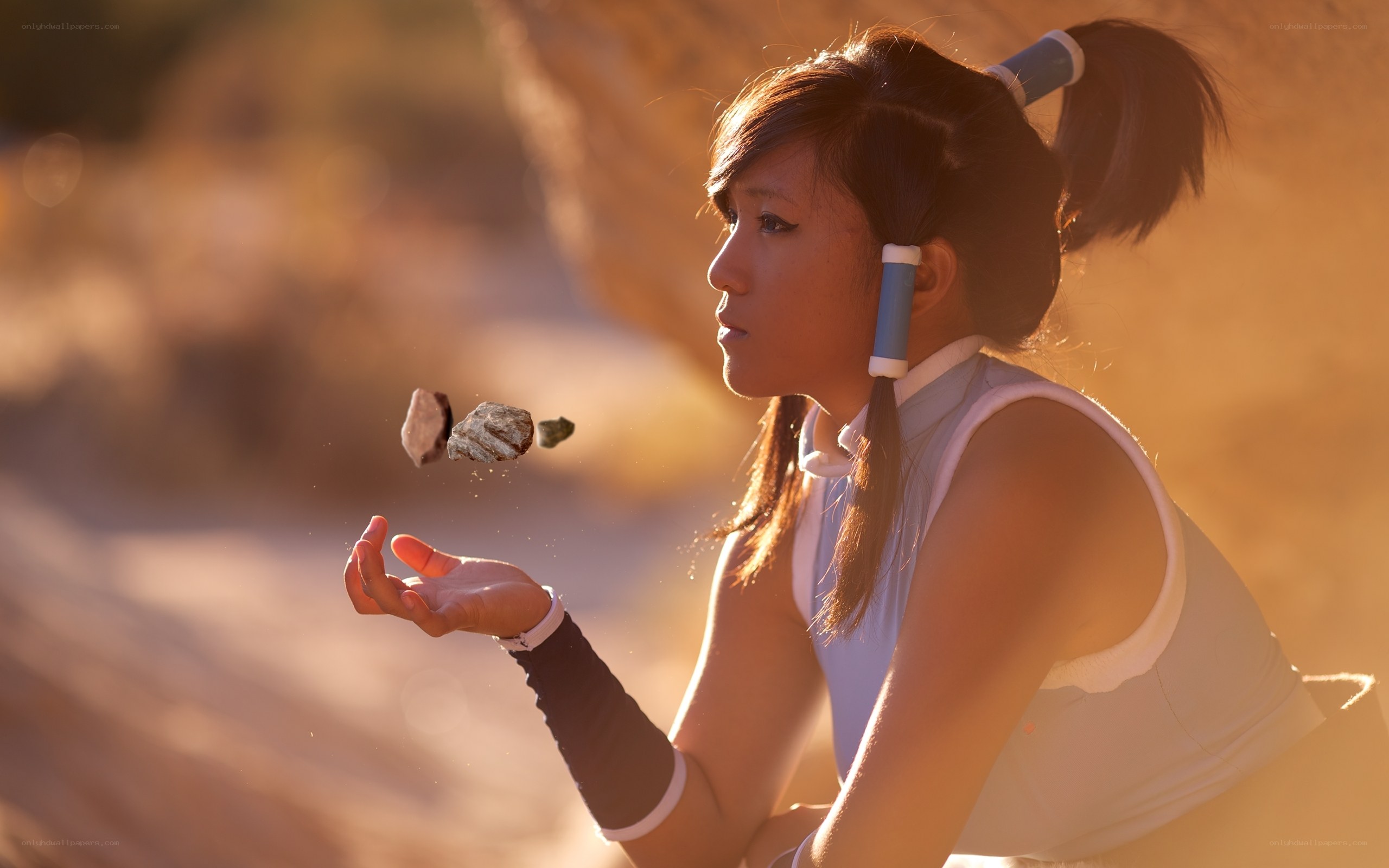 cosplayer with floating rocks