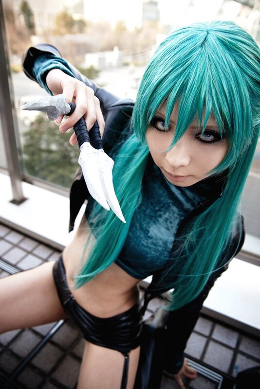 cosplayer with green hair and dagger