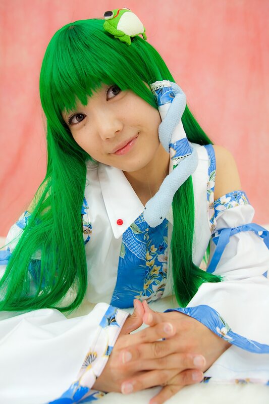 cosplayer with green hair and frog