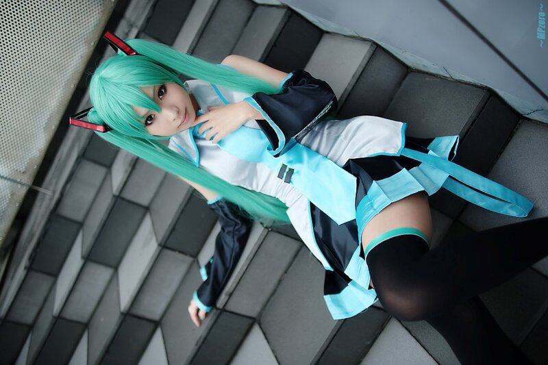 Cosplayer with Green Hair — Cyan