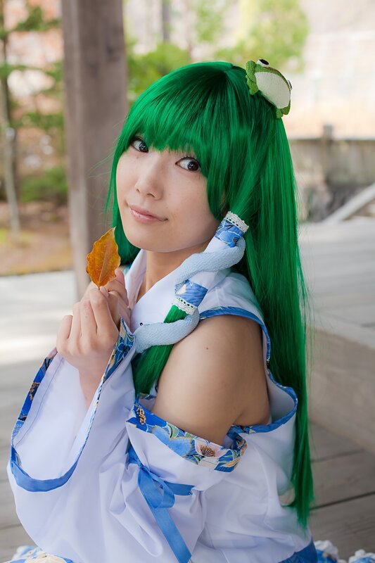 cosplayer with green hair holding leaf