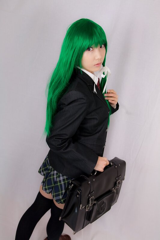 cosplayer with green hair in school uniform