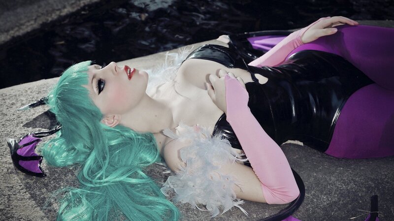 cosplayer with green hair lying down
