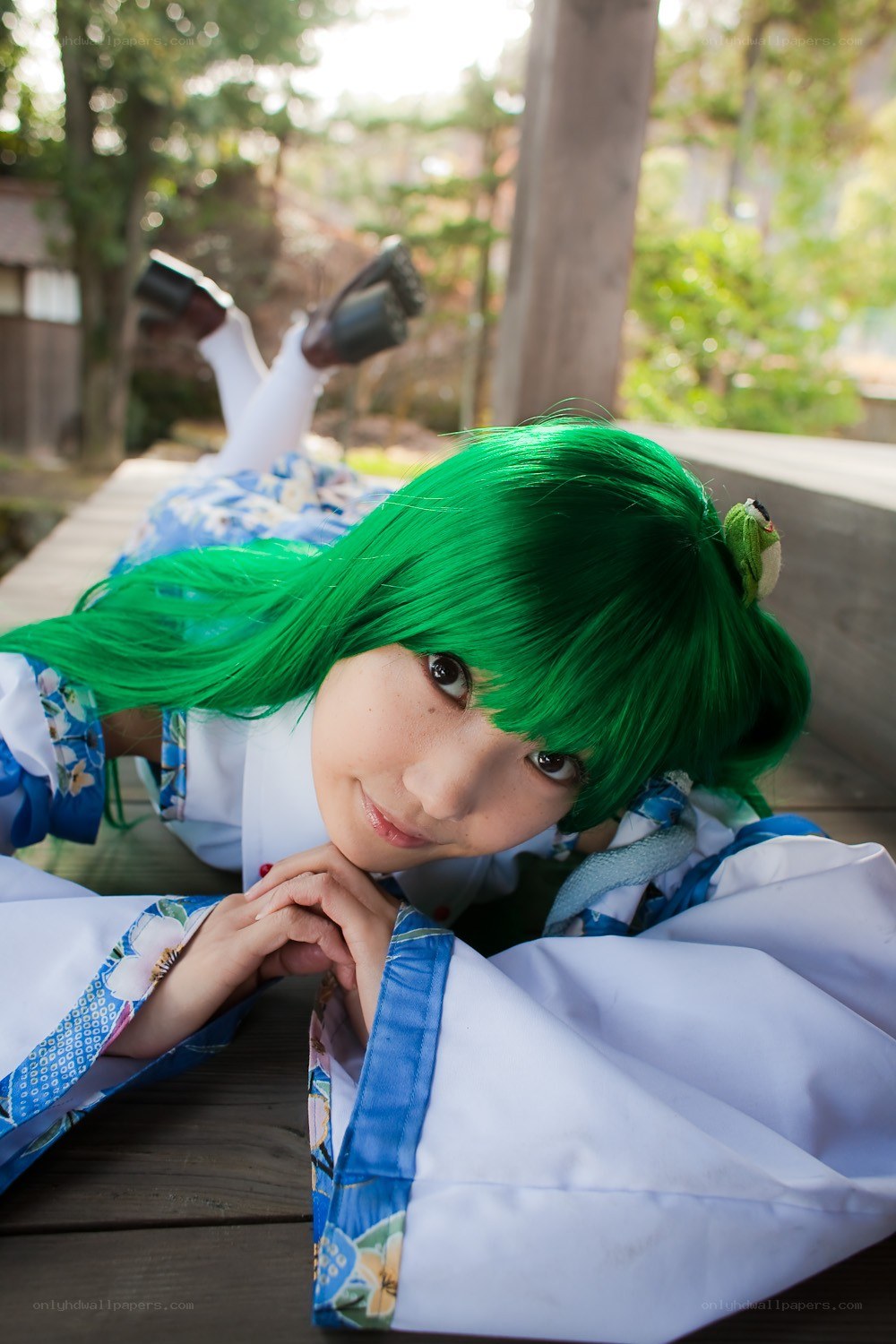 cosplayer with green hair lying down