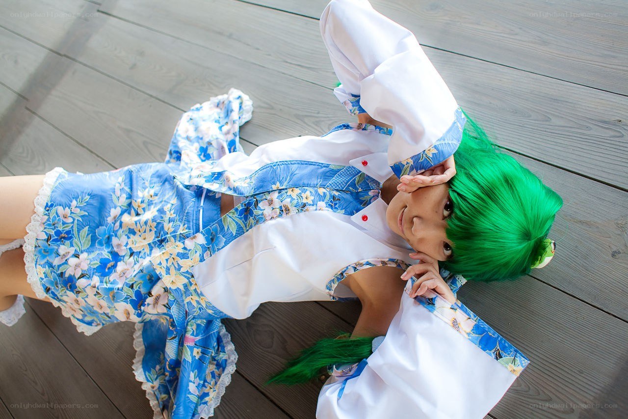 cosplayer with green hair lying down