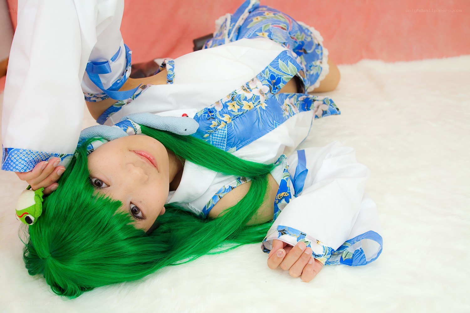 cosplayer with green hair lying down