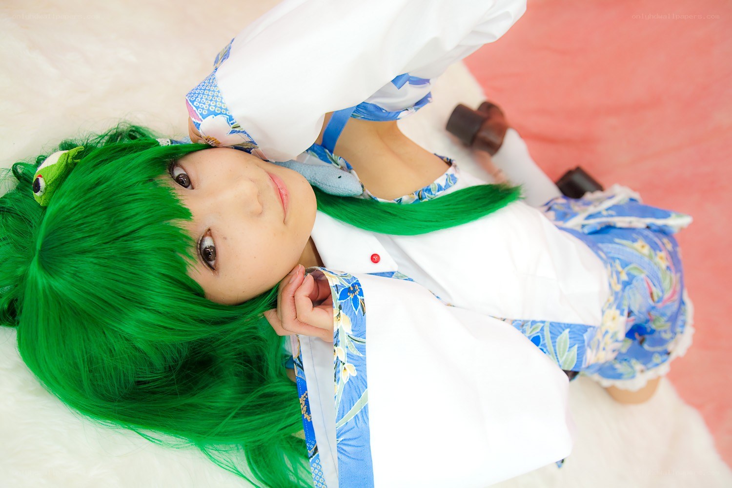 cosplayer with green hair lying down