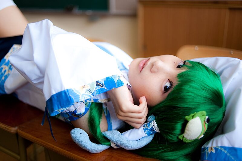 cosplayer with green hair lying down