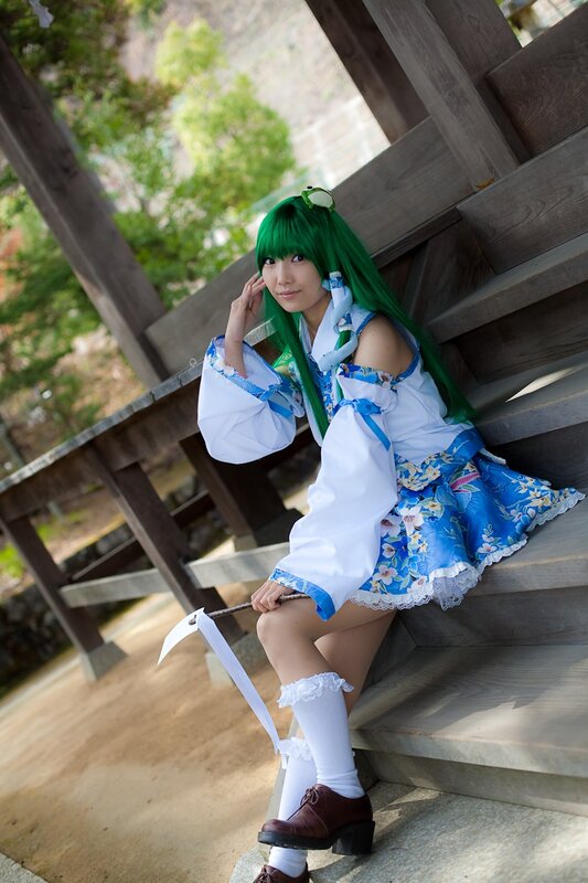 cosplayer with green hair on steps